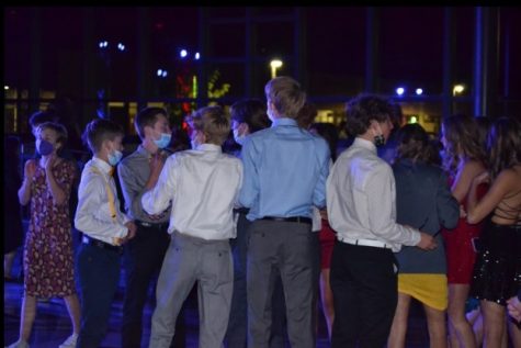 Getting some fresh air and resting their dance moves, the boys talk about the night amongst each other. Photo Credit: Lindsey Zamboni-Cutter
