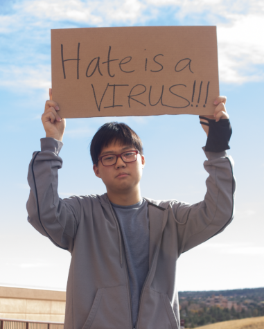 Young Park holds up Hate is a Virus sign
Photo Credit: Lindsey Zamboni-Cutter