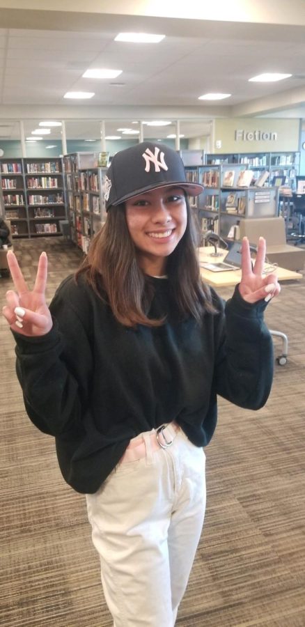 Junior Maribelle Morales displays her admiration for The New York Yankees with a trendy baseball cap. 