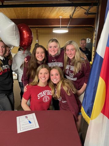 Caroline Bricker is surrounded by her teammates Paige Mckellop, Hannah Flip, Addyson Trinidad, and Bethany Slivka after her signing into Stanford