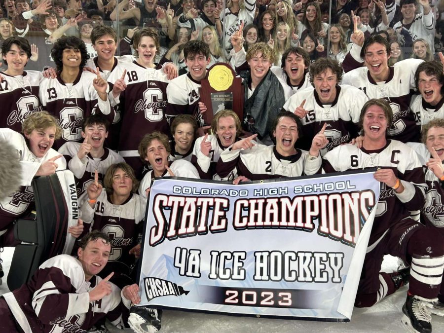 Cheyenne+Mountain+mens+hockey+celebrates+their+second+consecutive+State+Champion+win+with+the+student+section.